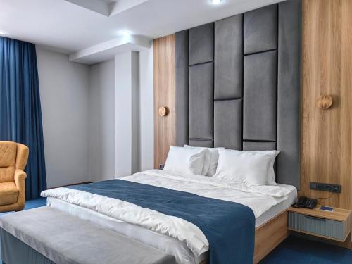 Katil atau katil-katil dalam bilik di Shymkent Park Hotel