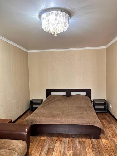 En eller flere senge i et værelse på Имидж теплая уютная квартира в центре