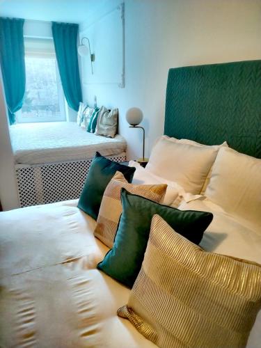 a room with a bed with pillows on it at Villa Monica in Lupeni