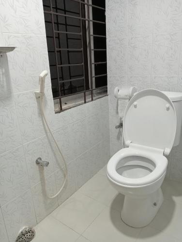 a bathroom with a toilet and a shower at Hotel In Need - Near to the US France Italy Saudi Embassy and Airport in Dhaka