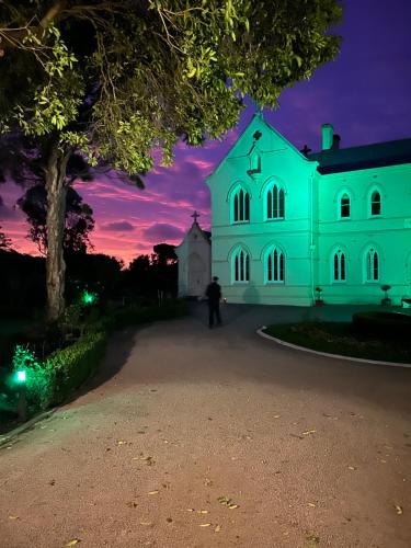a white building with a purple sky at night at Convent at Koroit in Koroit