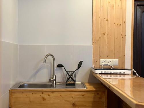a kitchen with a sink and a counter top at Teona's Guesthouse in Mestia in Mestia