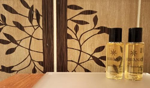 two bottles of essential oils sitting on a table at Apartaments Gory in Niedzica Zamek