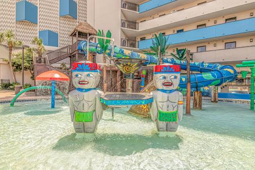 two statues in the water at a water park at Couples Retreat 409 in Myrtle Beach