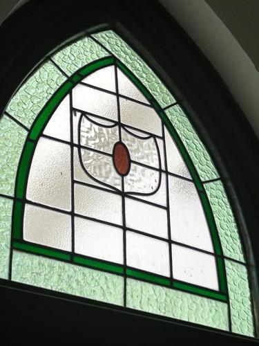 a stained glass window in a room at Convent at Koroit in Koroit