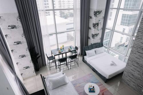 Katil atau katil-katil dalam bilik di NEW Maritime Luxury Pool View Duplex Suite 601