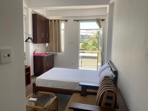 Ένα ή περισσότερα κρεβάτια σε δωμάτιο στο Apartment near Colombo Airport