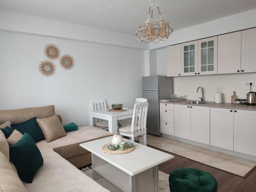 a living room with a couch and a table at Apartman DBB Nikšić in Nikšić