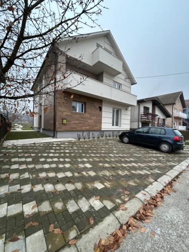a car parked in front of a house at La Mirage in Šabac