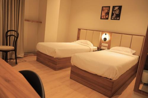 Cama o camas de una habitación en Hotel Krystal