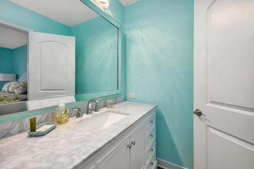 a bathroom with a sink and a mirror at 274 Moss Oak Lane in Saint Simons Island