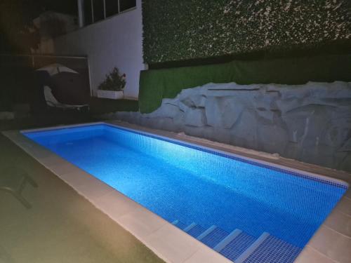 a swimming pool with blue water in a house at Villa Paraiso-Luxury Villa with Heated Pool in Adeje