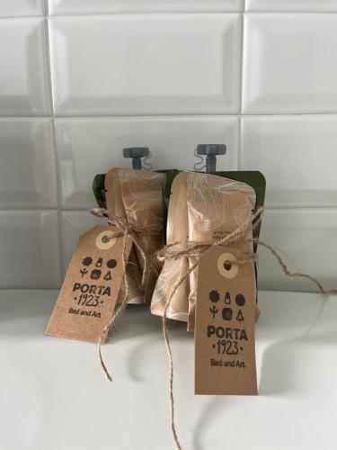 a couple of bags with price tags on them at Porta 1923 Bed and Art in Gravina in Puglia