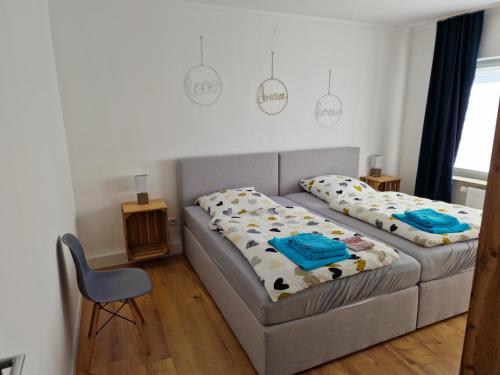 a living room with a couch and a bed at Friesenhaus1822 in Tettens in Wangerland