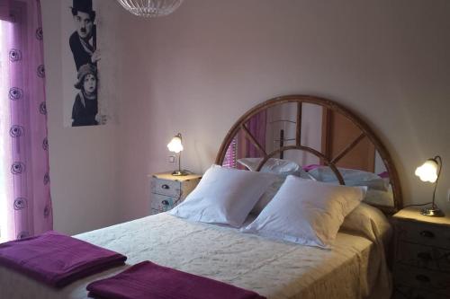 a bedroom with a bed with two purple towels on it at Luxury Villa at Golf Course in Costa de Antigua