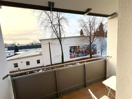 a balcony with a view of a white building at Sporthalle Graz, Stadtpanorama in Graz