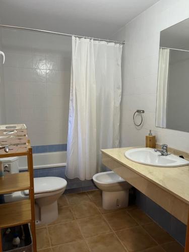 a bathroom with a toilet and a sink and a shower at MOJACAR WITH POOL, BEACH AND GoLF in Mojácar