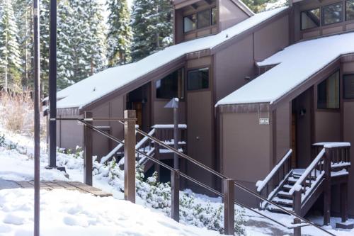 a building with snow on the side of it at Lofty Retreat, Condo in Northstar in Truckee