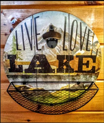 a sign that says live love feed on a wall at Lakeview Retreat in Lakeville
