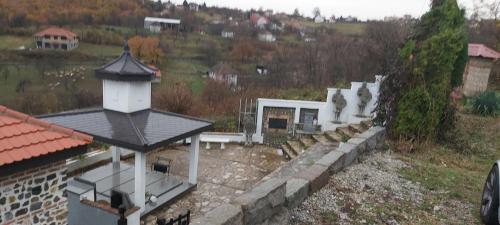 an aerial view of a building with a stone wall at Apartmani Doksas Degurić in Belić