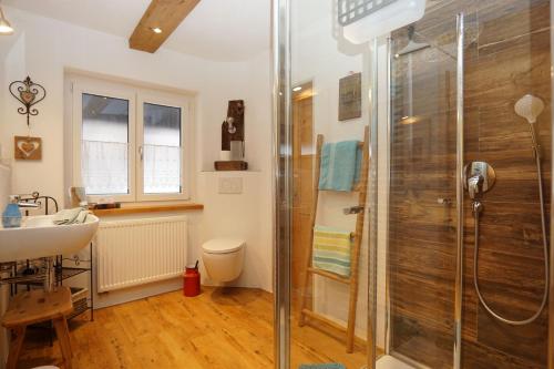 a bathroom with a shower and a sink at Pension Marianne - Chiemgau Karte in Inzell
