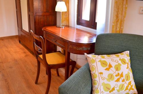 a room with a desk and a chair and a table at Hotel Ellique in Rhodes Town