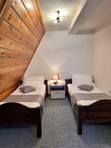 Postel nebo postele na pokoji v ubytování Pansion Zlatna Zita