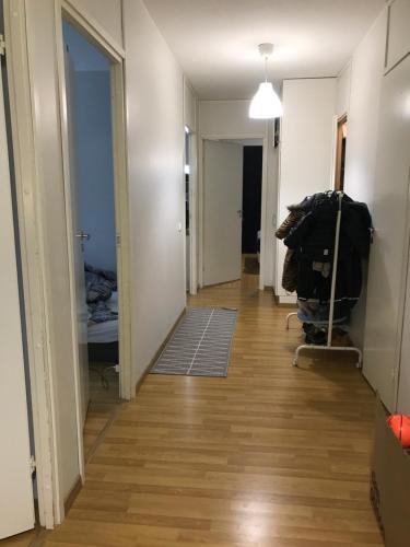 a hallway of an apartment with a hallwayngth at Cosy room in Pasila in Helsinki