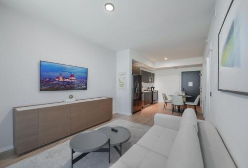 a living room with a white couch and a table at Captivating Bayside Apartment at Downtown Miami in Miami