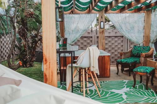a gazebo with chairs and a table at Villa La'Vie in Witbank