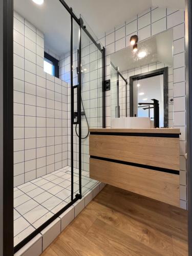 a bathroom with a sink and a mirror at Danube Luxury Suite in Budapest