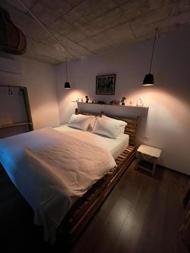 a bedroom with a large bed in a room at Vila Ndrio in Pogradec