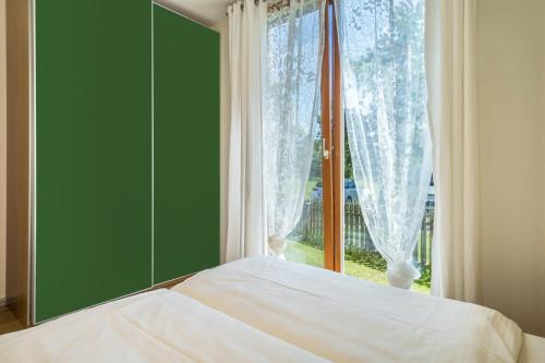 Ένα ή περισσότερα κρεβάτια σε δωμάτιο στο Ferienhaus Im Tobel