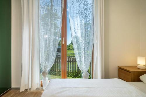 Ένα ή περισσότερα κρεβάτια σε δωμάτιο στο Ferienhaus Im Tobel