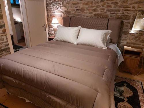 Кровать или кровати в номере Αρχοντικό Εξοχή - Villa Exohi