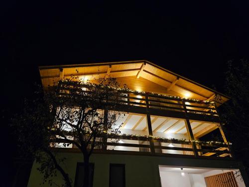 a building with lights on top of it at night at Casa Mara Viseu de Sus in Vişeu de Sus