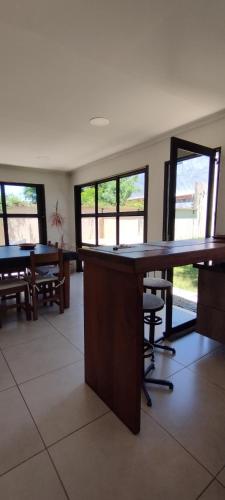 an empty office with a large wooden table and chairs at Casa D a 2 - Con Parrilla - Centro de Federación in Federación