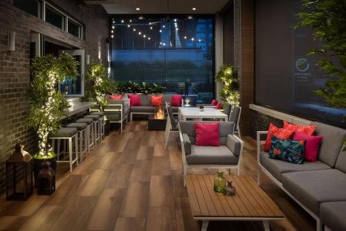 a restaurant with couches and tables in a room at Element Atlanta Buckhead in Atlanta