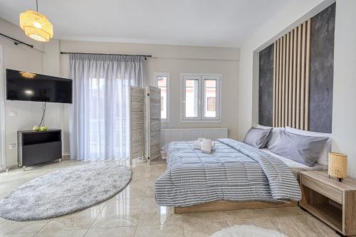 Ένα ή περισσότερα κρεβάτια σε δωμάτιο στο V&V Central Apartment in Pyli Vol. 2