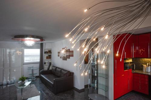 a living room with a couch and christmas lights at Wohnung mit Dachterrasse in Mörfelden-Walldorf