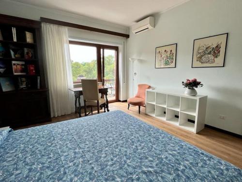 a bedroom with a bed and a desk and a window at Green & relax near S.Peter in Rome