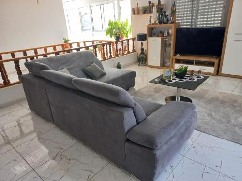 a living room with a couch and a table at Casa Graciosa in Tarrafal