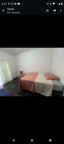 a picture of a bedroom with a bed at Pensão da Rose in Sorriso