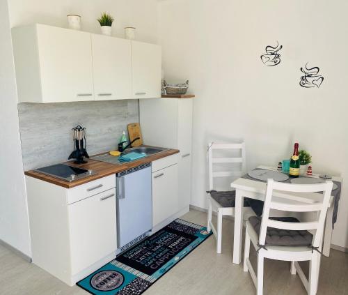 Η κουζίνα ή μικρή κουζίνα στο Ferienwohnung am Kap