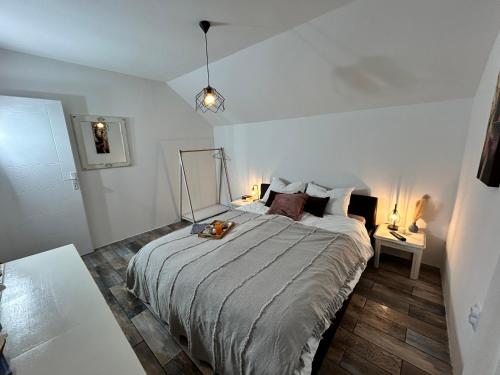 a bedroom with a large bed in a room at Vila Stanjevac, Sarajevo in Sarajevo