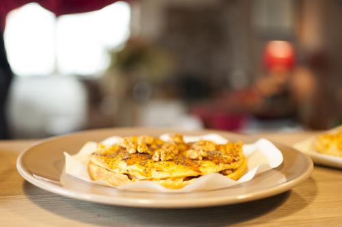 a plate with a piece of food on a table at Maison d'hôtes Victoret in Challand Saint Victor