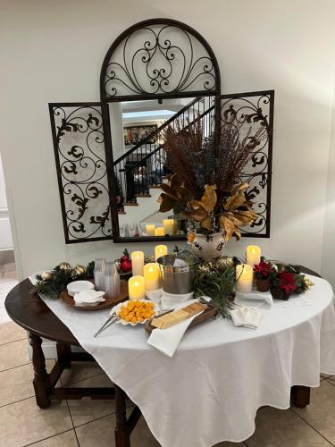 a table with a white table cloth and candles on it at Hotel Rehoboth in Rehoboth Beach