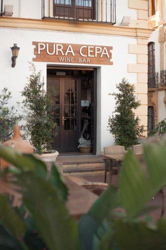 a entrance to a wine bar with a sign on it at Hotel Palacio de Hemingway in Ronda