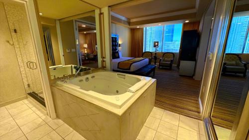 a large bathroom with a large tub in a room at Westgate Las Vegas Resort & Casino located in the heart of Las Vegas Nevada 5Minutes Walk to Las Vegas Convention Center in Las Vegas