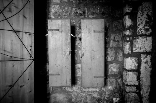 a pair of doors in a brick wall at Inter Artes Prestige House and Luxury Suite in Viterbo